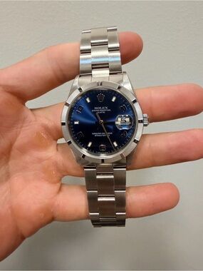 Rolex Stainless Steel Watch with Blue Dial and Silver Bracelet